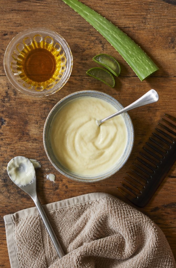 Amla oil and yogurt arranged for a pre-wash hair mask