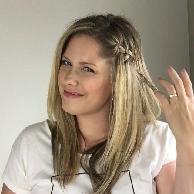 Woman with blonde hair featuring a small side braid pulling hair back.